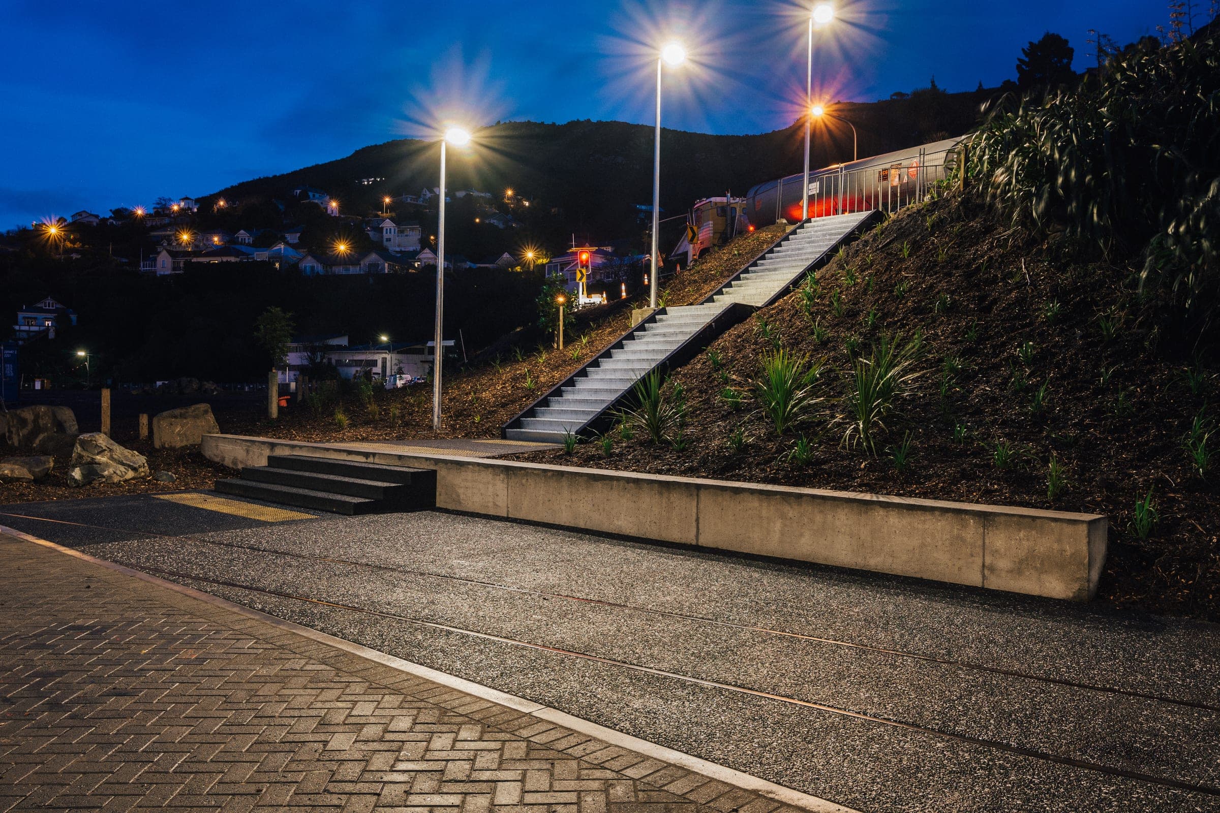 Hard-wearing exposed-aggregate flatwork, finished to a public-space standard.